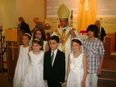 Bishop Joseph Perry with those receiving confirmation
and First Communion, May 18, 20l4
